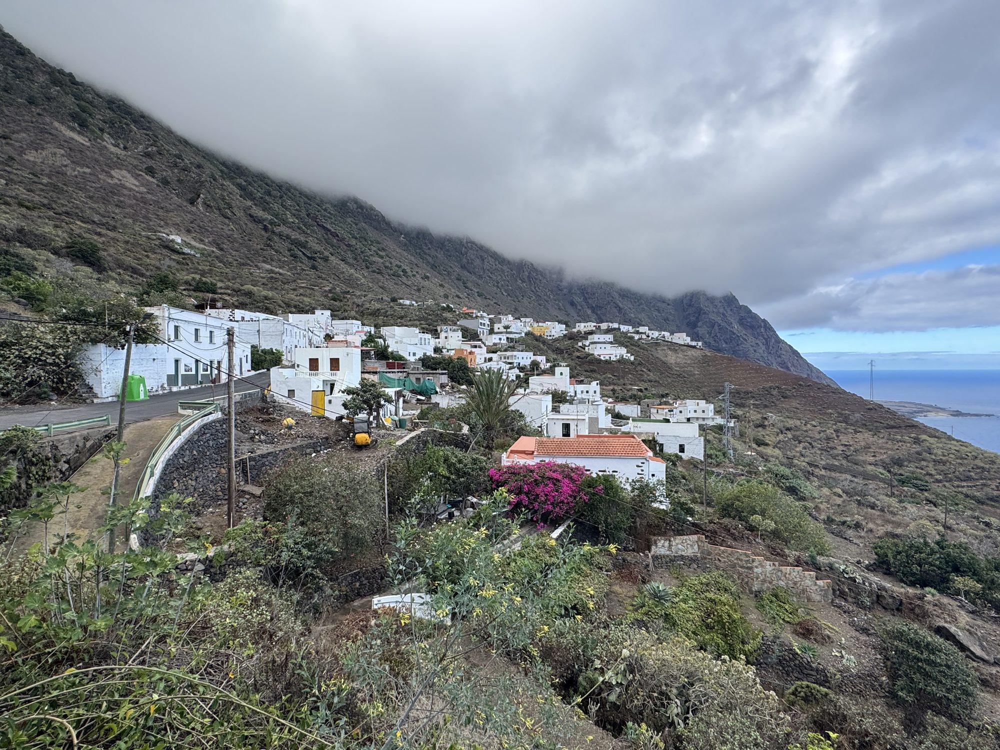 White village houses at the foot of the cliffs of the El Golfo valley, El Hierro