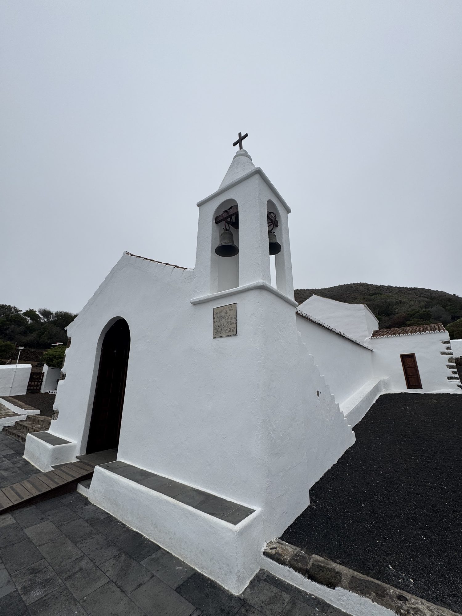 White chapel with a bell gable at the Sanctuary of Nuestra Señora de los Reyes, El Hierro