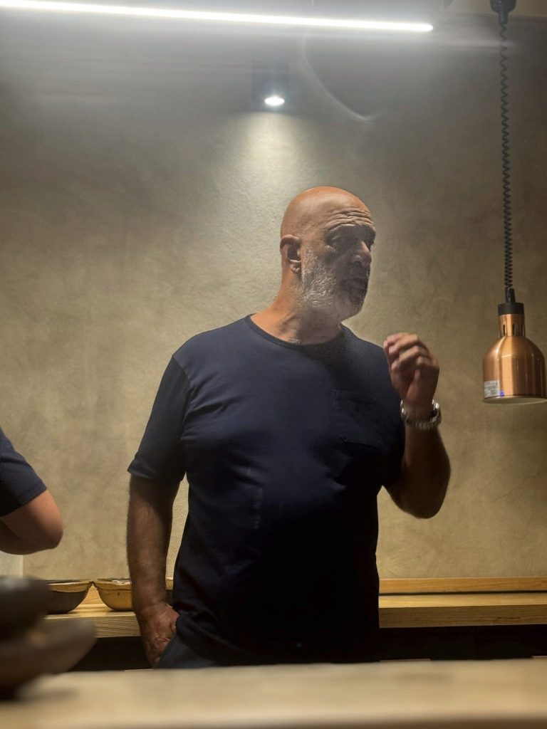 Chef Marcos Tavío talking behind the counter of his restaurant, El Hierro